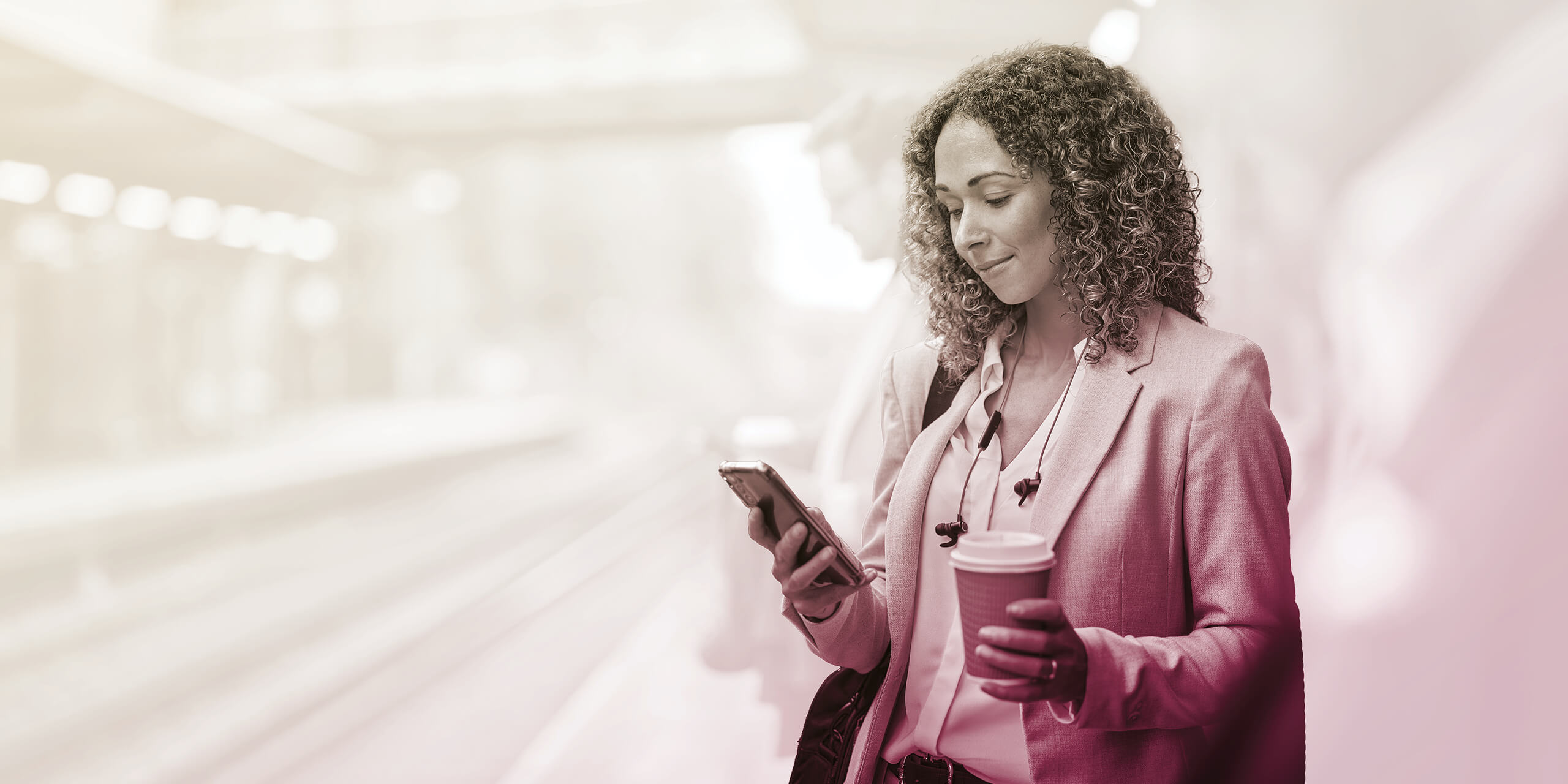 Woman checking phone during morning commute