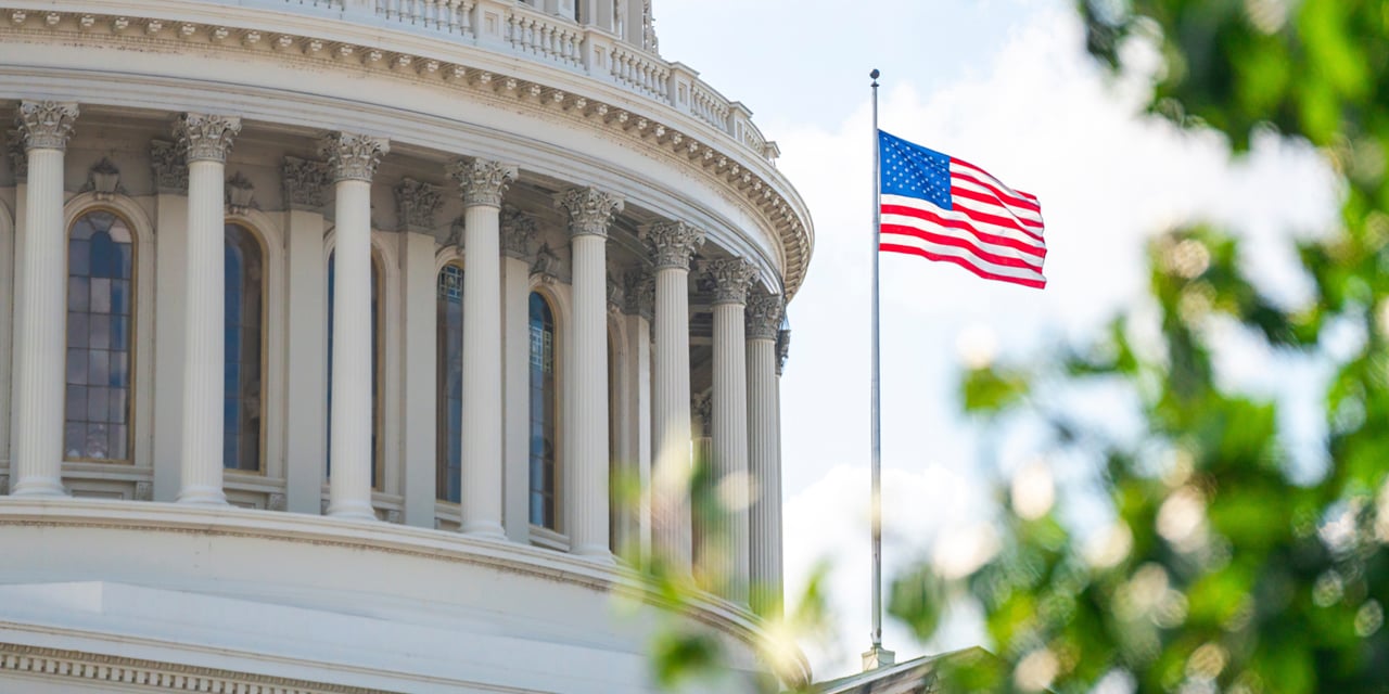 United States Capitol building with an American flag in front
