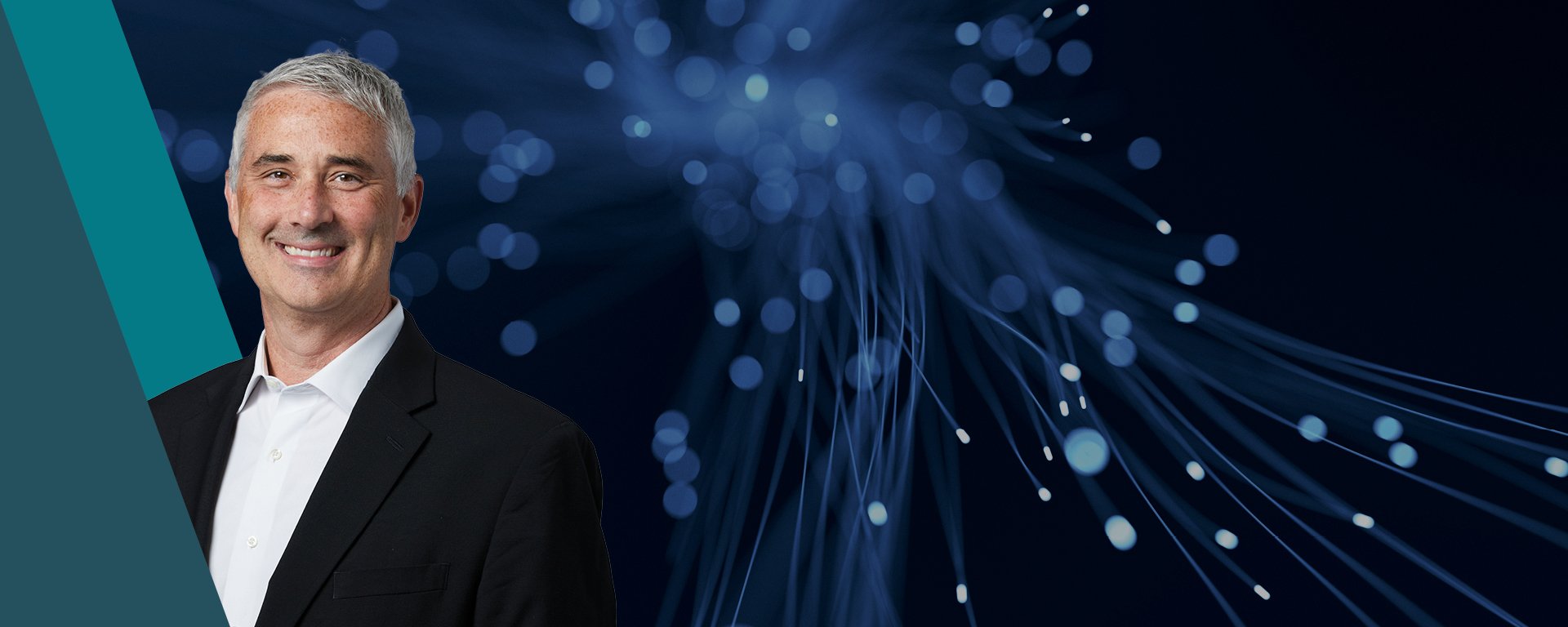 Michael Antonelli with blue abstract background