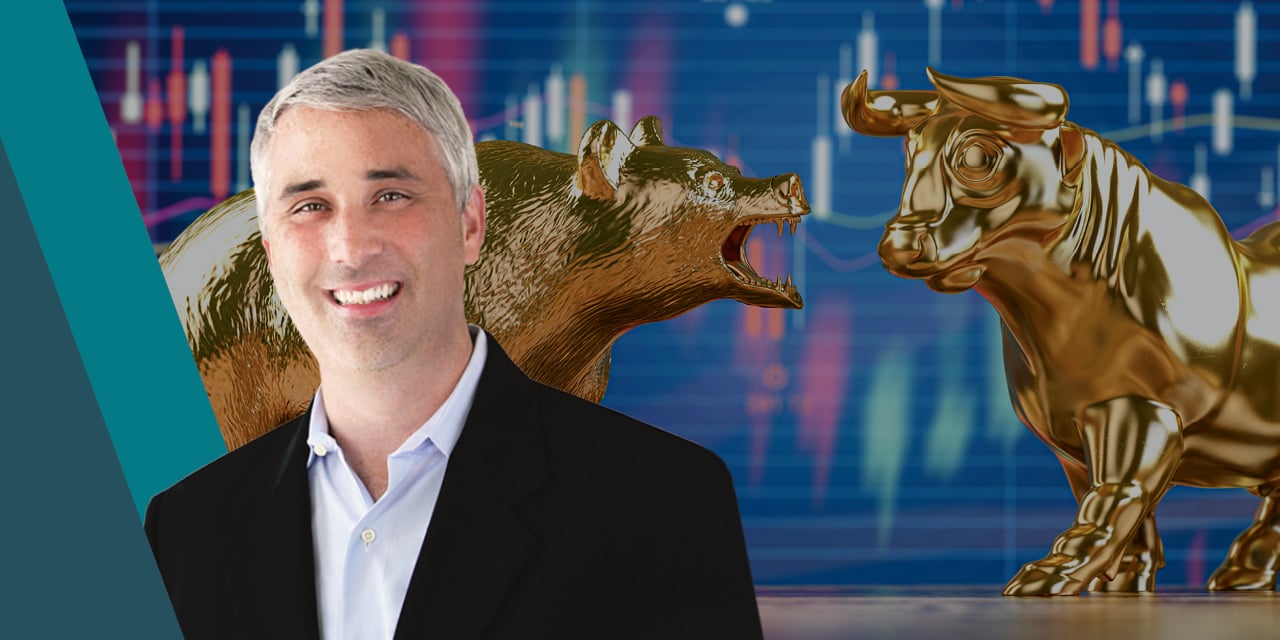 Headshot of Michael Antonelli with statues of a bear and a bull in the background. 