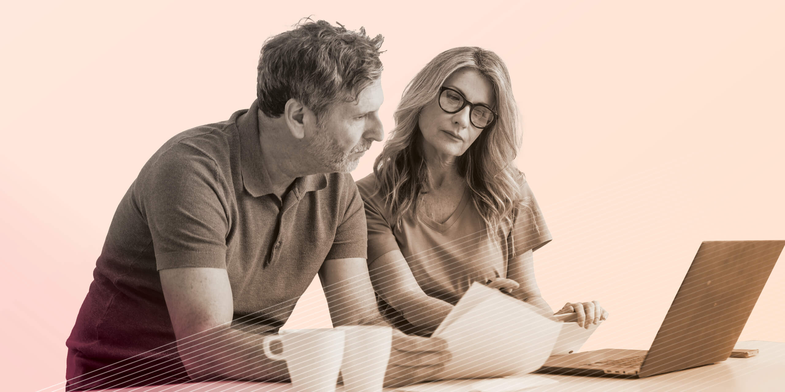 Mature couple using laptop