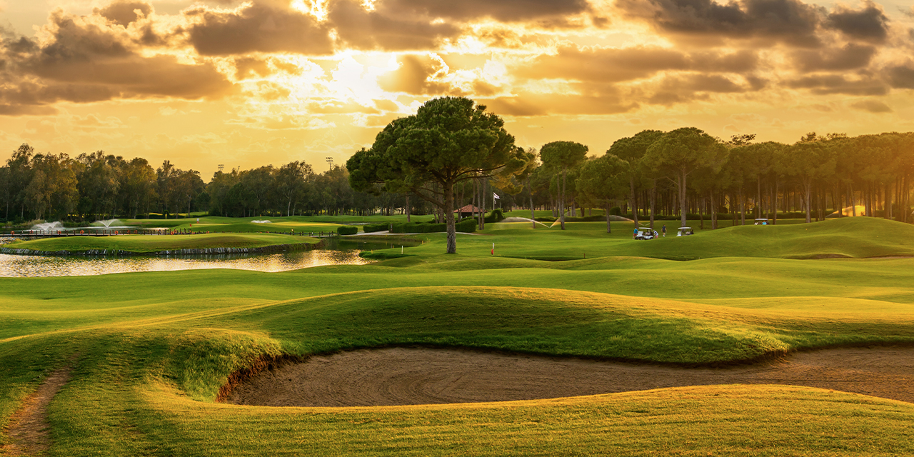 Sun rising over a golf course