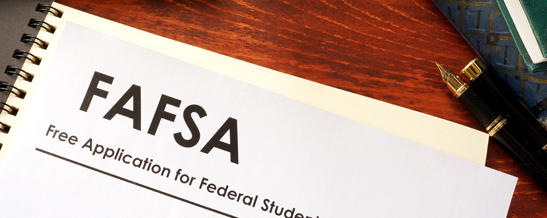 FAFSA paperwork on a desk.