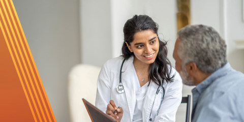 Doctor and patient reviewing a patient chart