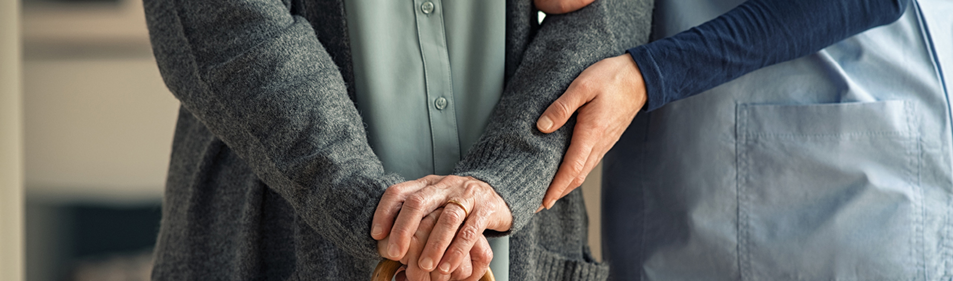 Nurse helping an elderly patient.