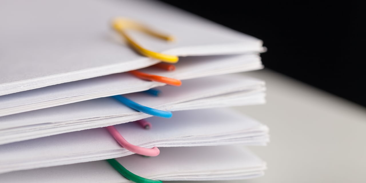 Stacks of paper clipped files