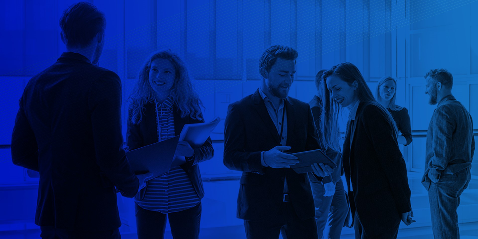 Abstract image of associates conversing in a lobby with a blue tinted overlay