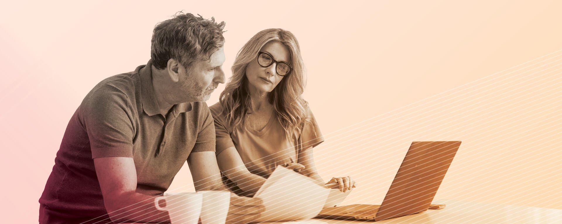 Mature couple using laptop