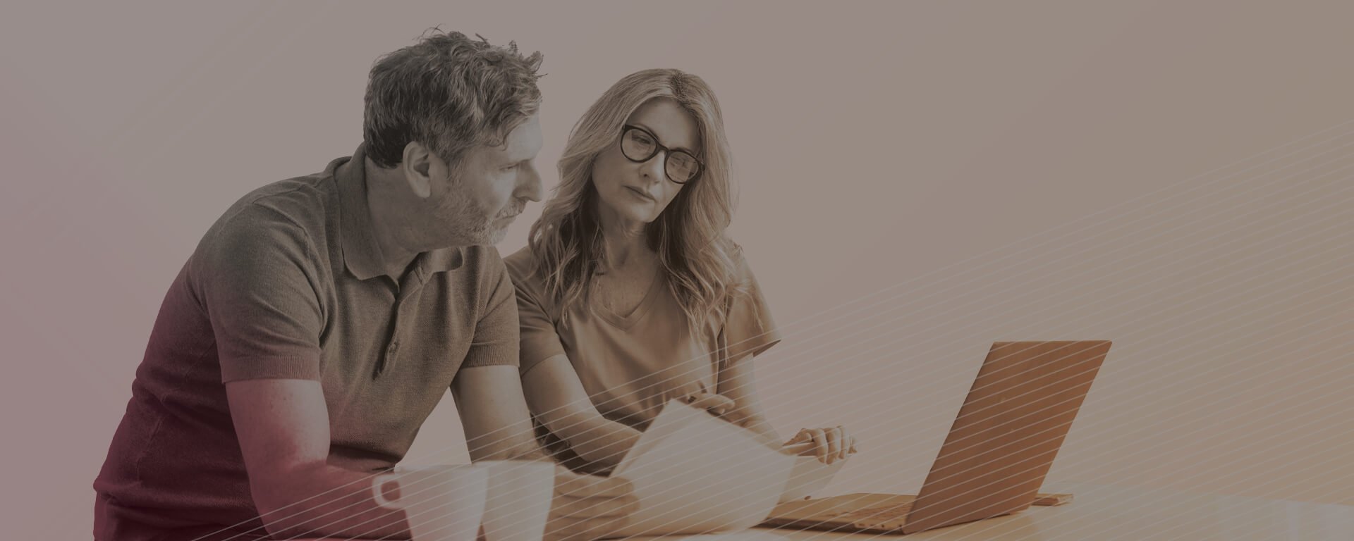 Mature couple using laptop