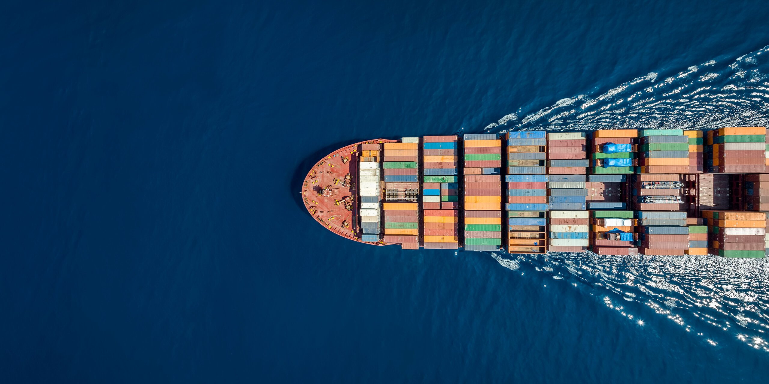 Aerial view of barge carrying containers