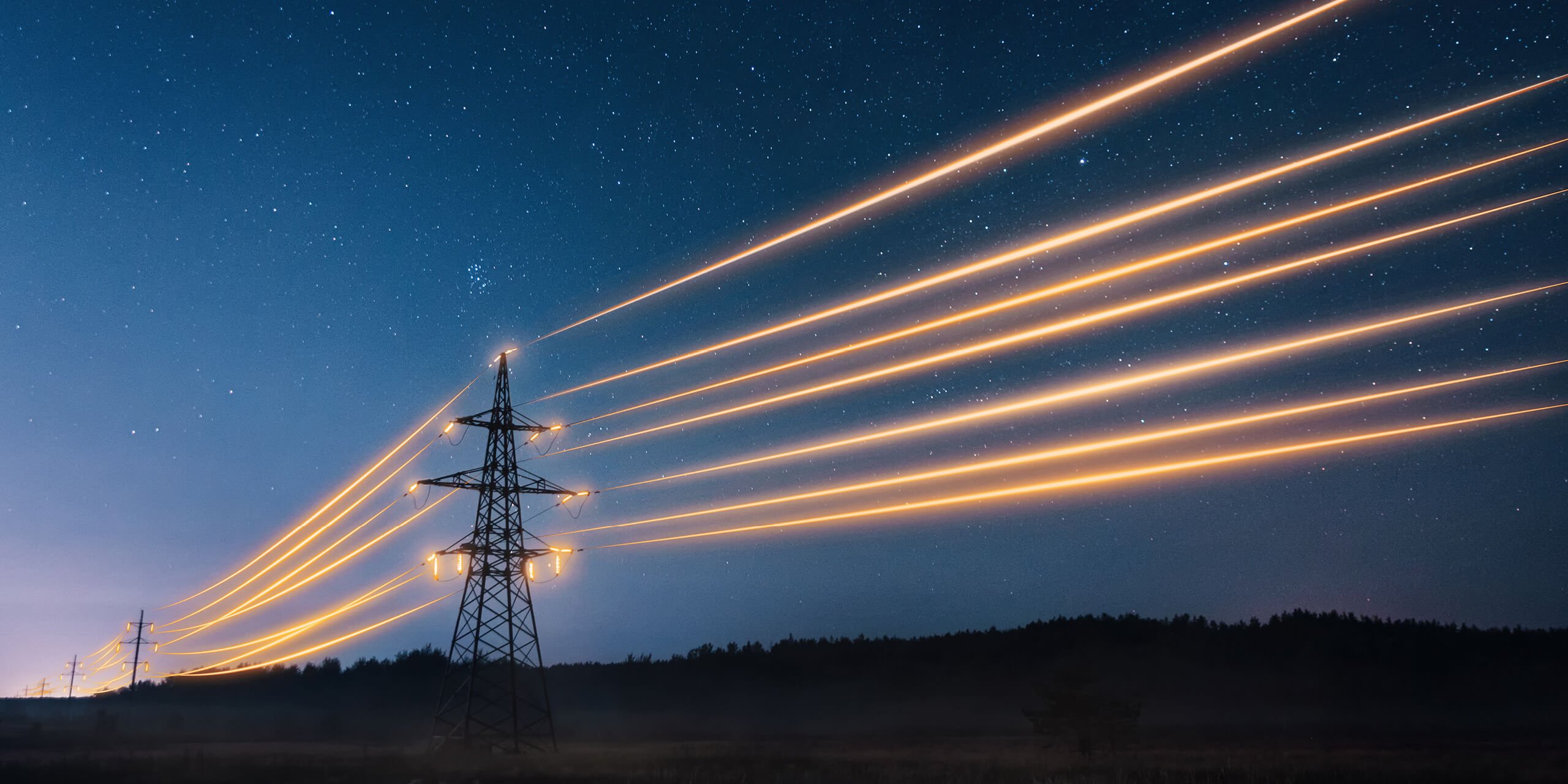Electricity transmission towers with orange glowing wires the starry night sky