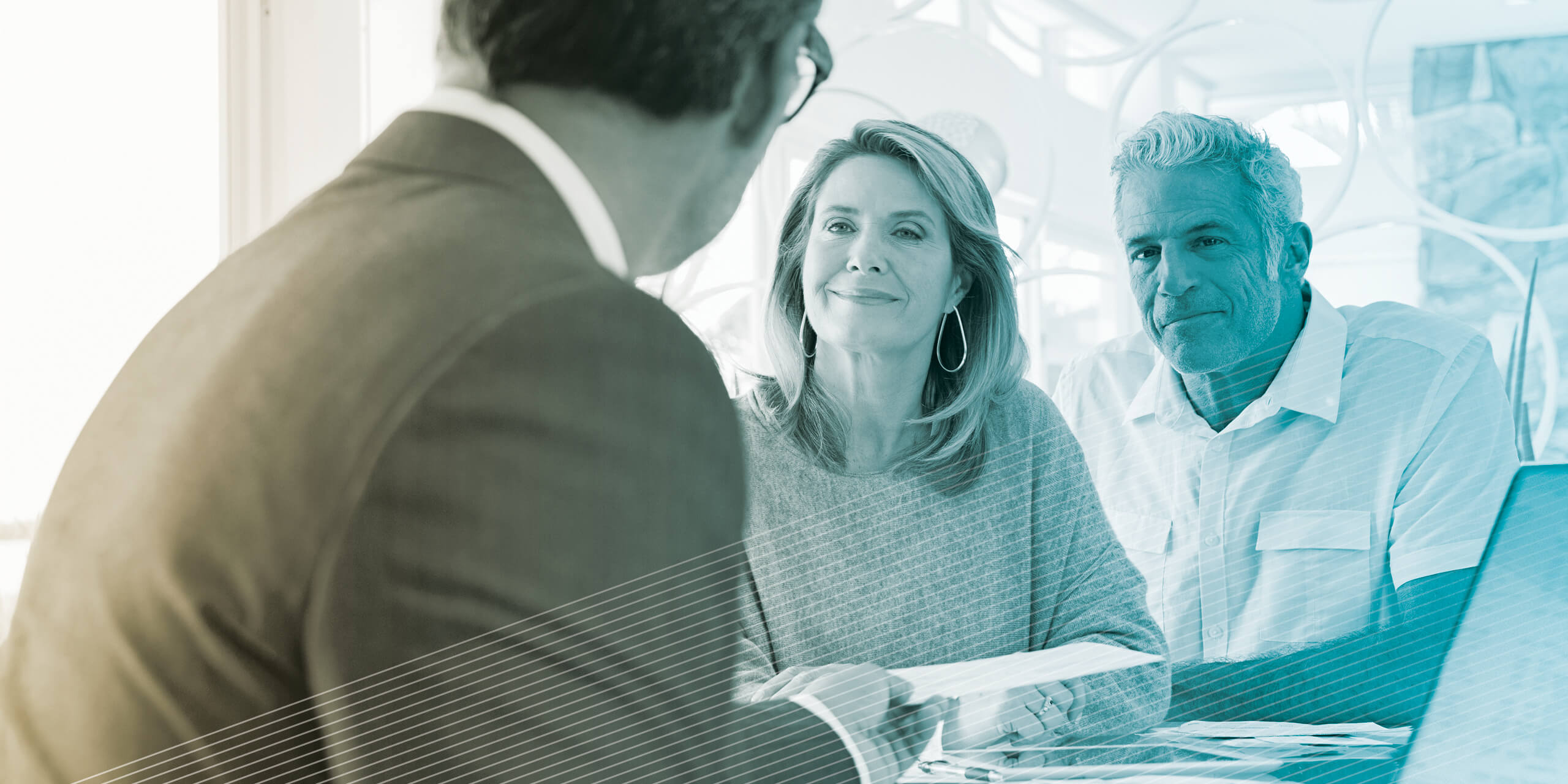 Mature couple talking to financial advisor