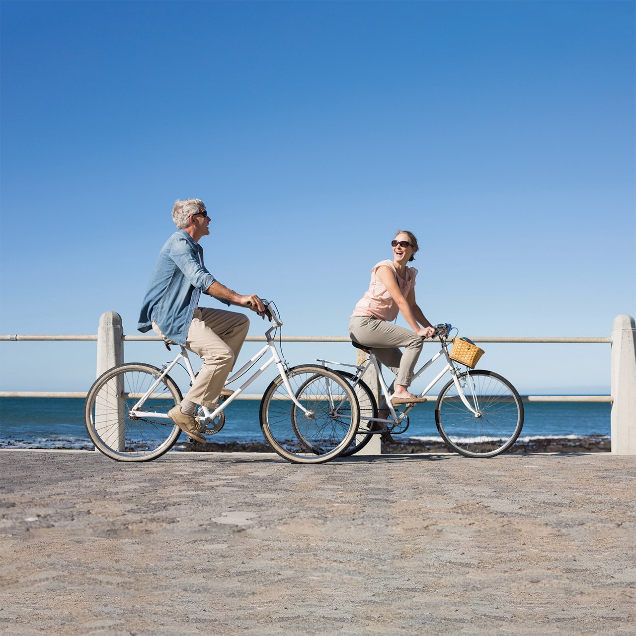 Couple biking along a waterfront