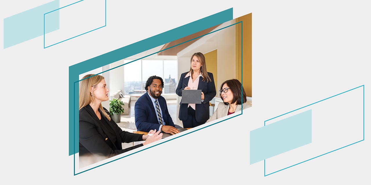 Teal parallelograms framing four Baird associates gathered around a conference table