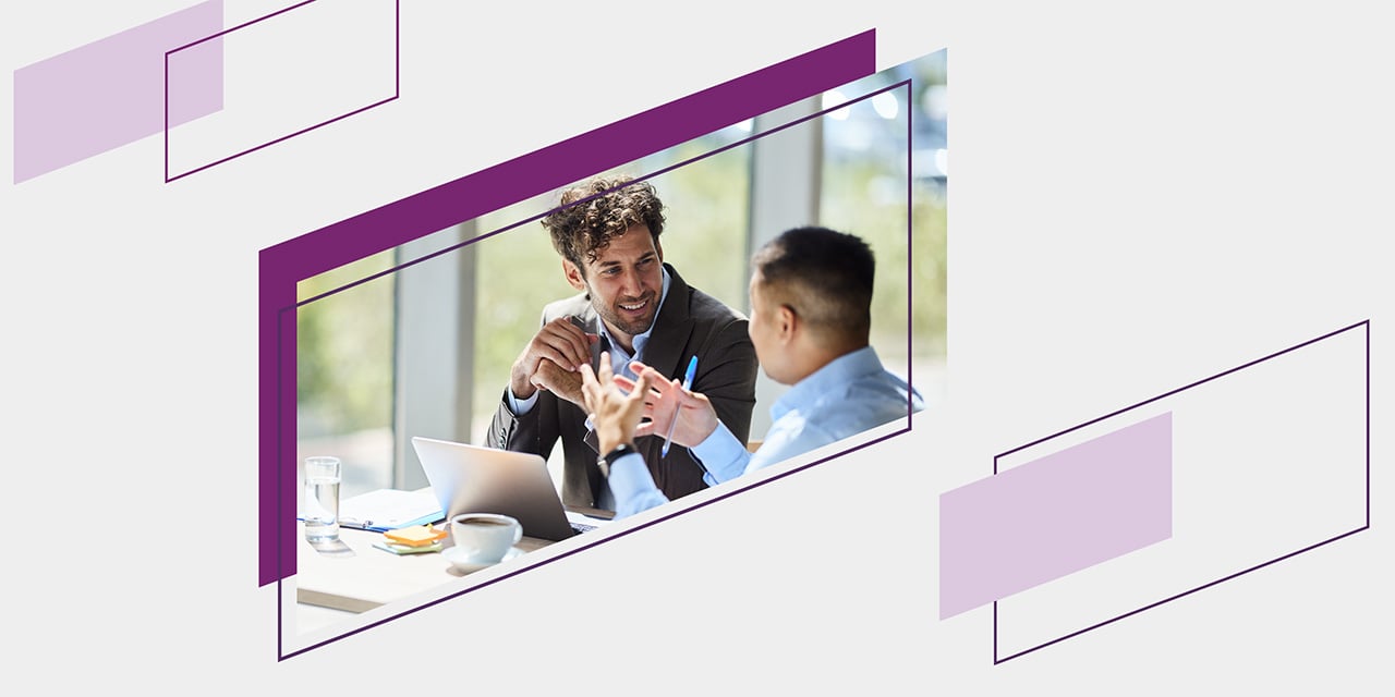 Purple parallelograms framing a financial advisor in conversation with a client