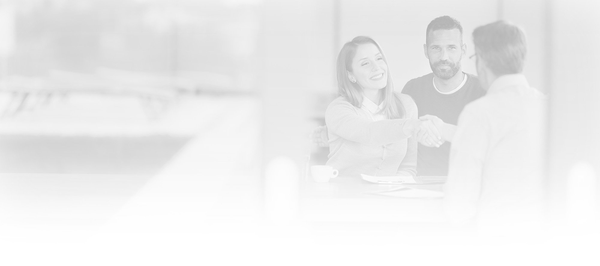 financial advisor meeting with a young couple