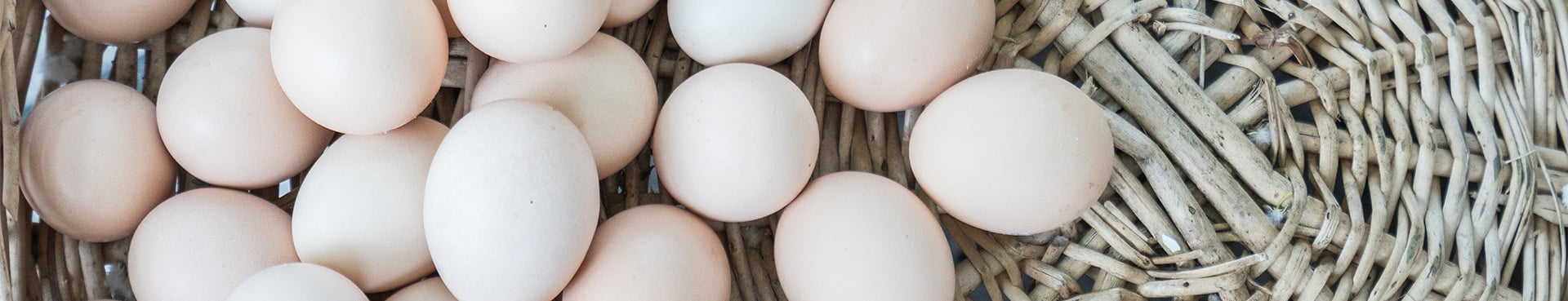 Cropped image of eggs in a wicker basket
